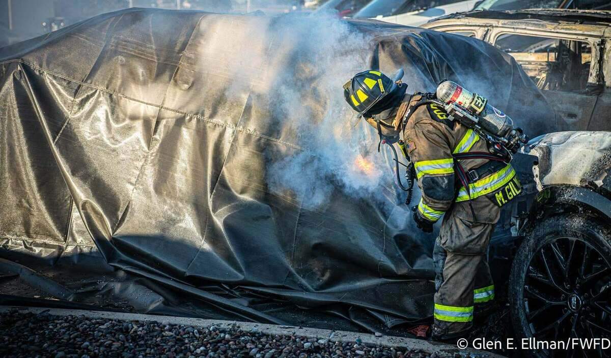 Fort Worth firefighters battled for almost 18 hours after six electric SUVs were destroyed and two others damaged in a fire at a Cadillac dealership on Friday.